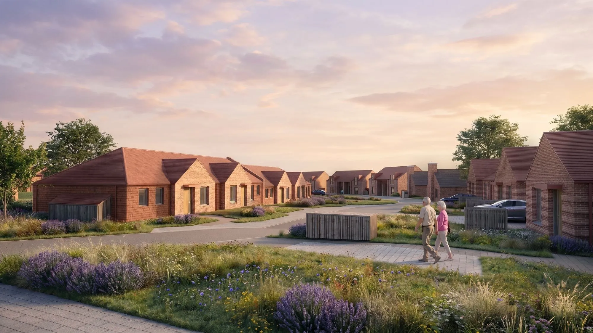 Brick bungalows along a landscaped path at Copse Close, Bramston Park, at sunset