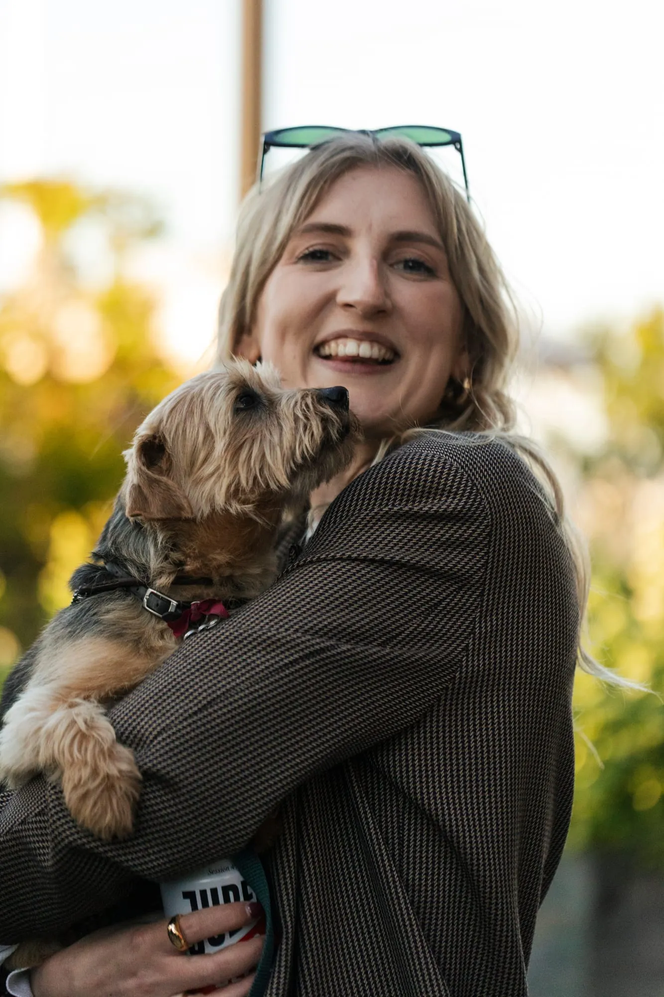 A team member with the studio dog on the roof terrace