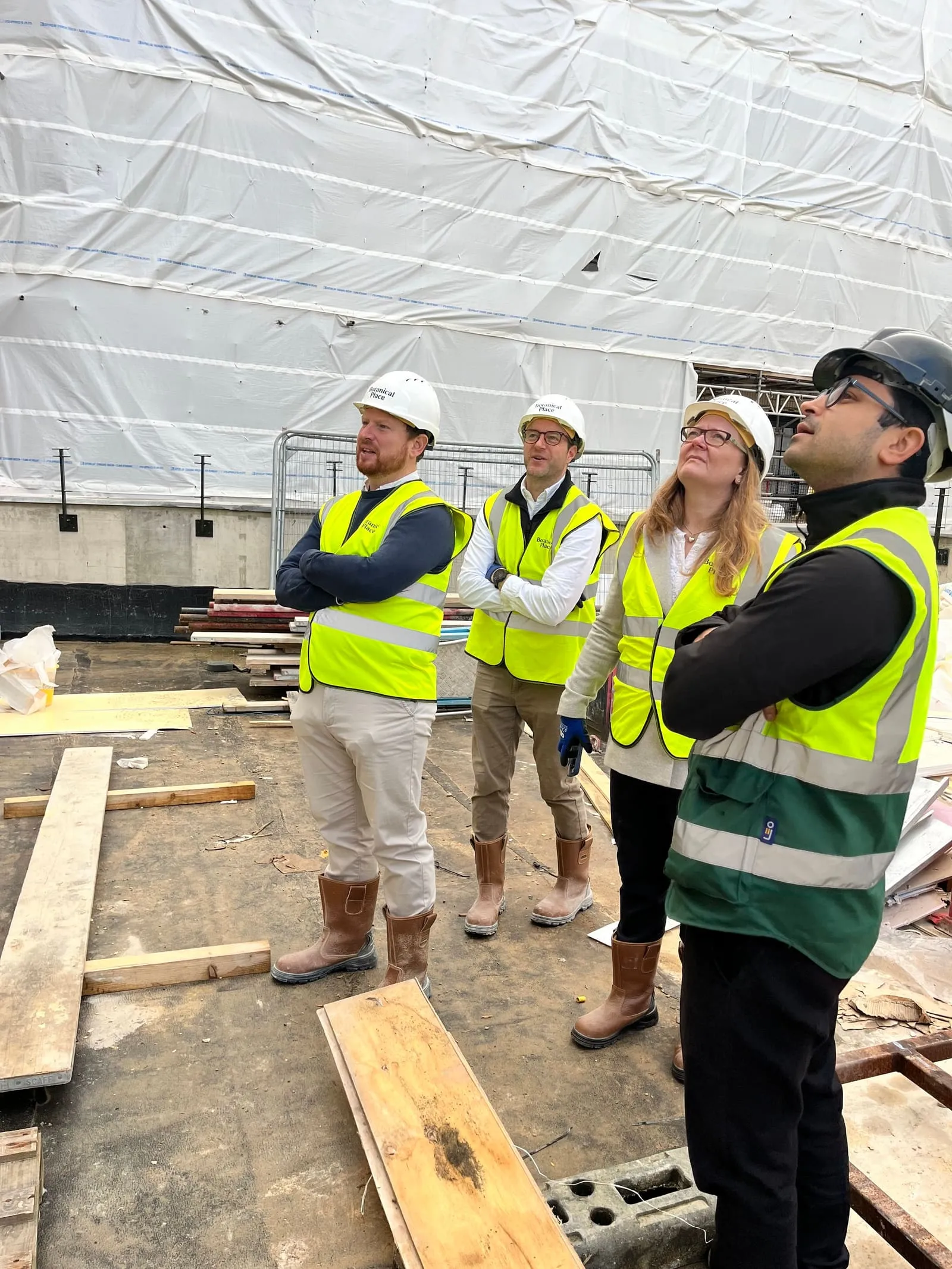 The amn architects team on a construction site visit