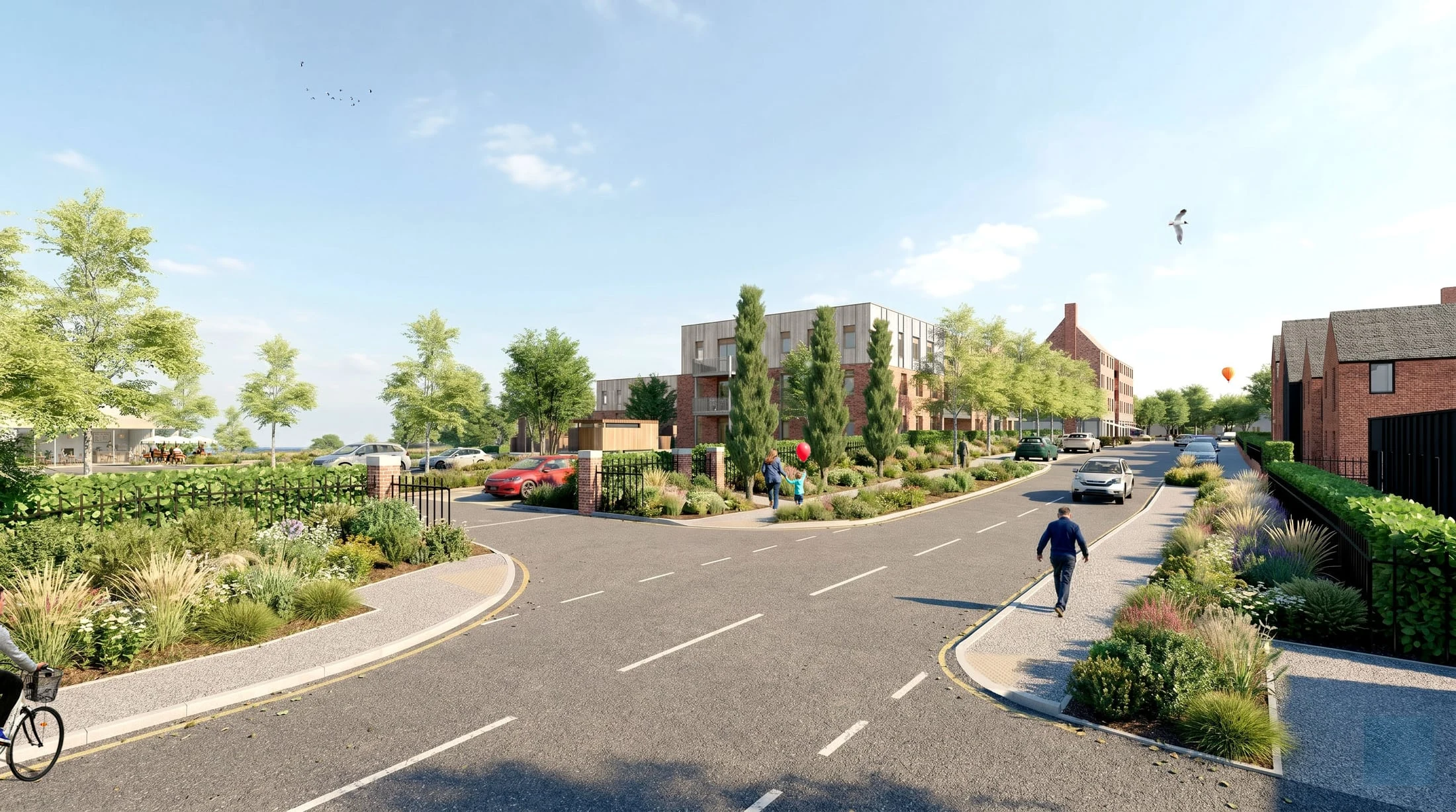 A tree-lined village street at Kinford with homes and planting